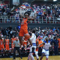 Young’s DJ Steward (21) gets a fast break for a dunk against Curie, Friday 03-08-19. Worsom Robinson/For the Sun-Times.