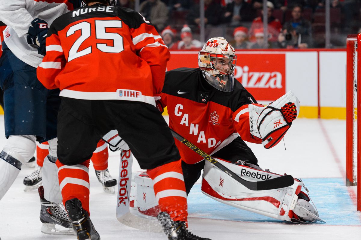 MONTREAL, QC - DECEMBER 26: Goaltender Zachary Fucale #31 of Team Canada makes a glove save during the 2015 IIHF World Junior Hockey Championship game against Team Slovakia