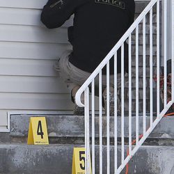 Officers investigate a fatal shooting Sunday, Dec. 28, 2014, of Nicholas Mcghee 28, of Stansbury Park.  