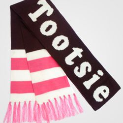 <a href="http://www.fredflare.com/ACCESSORIES-hats-scarves-and-gloves/Tootsie-Roll-Scarf/" rel="nofollow">Fred Flare Tootsie Roll Scarf:</a> $28