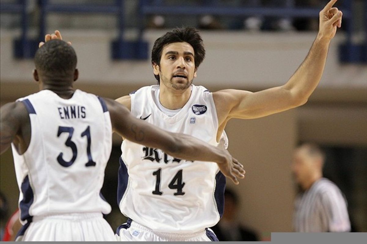 March 03, 2012; Houston, TX, USA; Rice Owls forward Arsalan Kazemi (14) reacts after scoring a basket in the second half against the Houston Cougars at Tudor Fieldhouse. Mandatory Credit: Troy Taormina-US PRESSWIRE