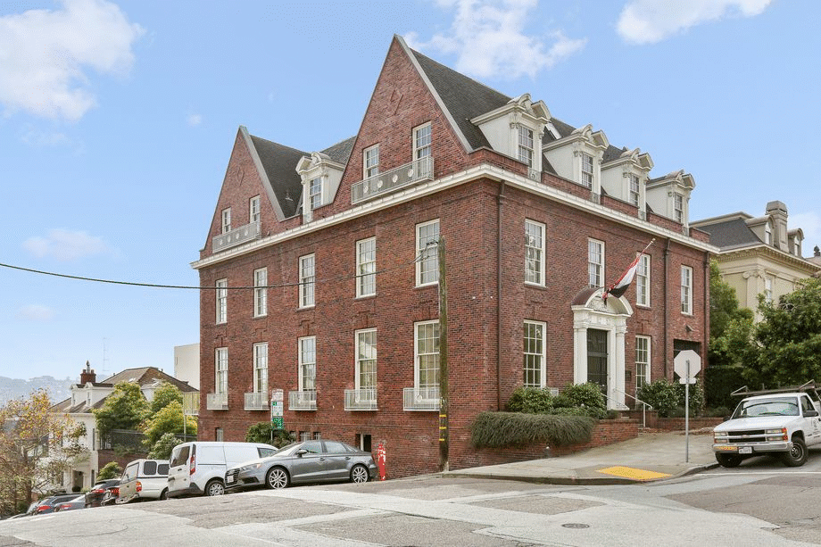 A large house with a red brick facade.