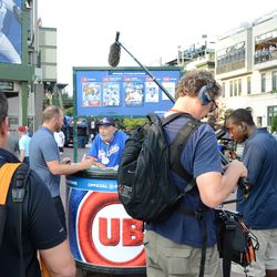 Tue 5:52 p.m. Scorecard vendor Walter being interviewed by Ryan Dempster, outside of Gate D - 