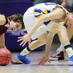 Viewmont's Jake Walker tries to take the ball away from Taylorsville's Connor Ivins during play Monday, Feb. 23, 2015, in the first round of the 5A boys basketball tournament at Weber State in Ogden. Viewmont won 70-44.