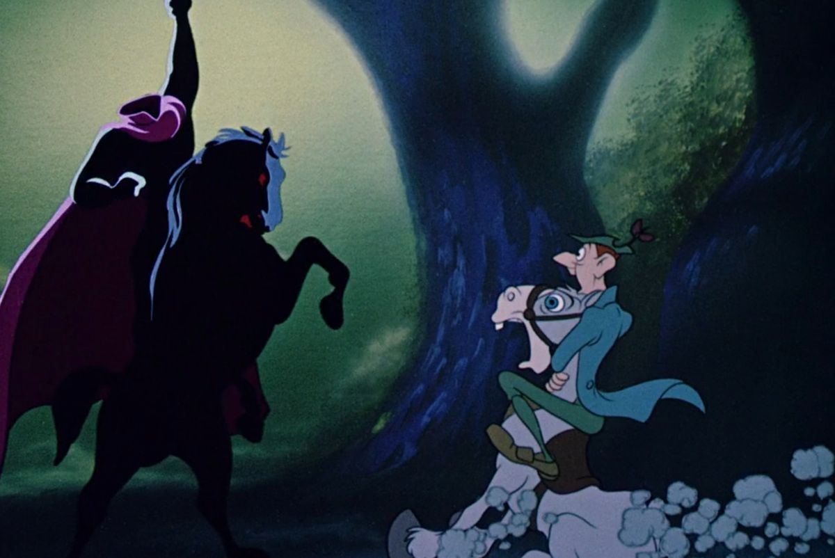 Scrawny, pigtailed cartoon schoolmaster Ichabod Crane clings to the neck of his screaming, terrified horse as they confront the largely silhouetted figure of the Headless Horseman atop his rearing black stallion in the Disney short “The Legend of Sleepy Hollow”