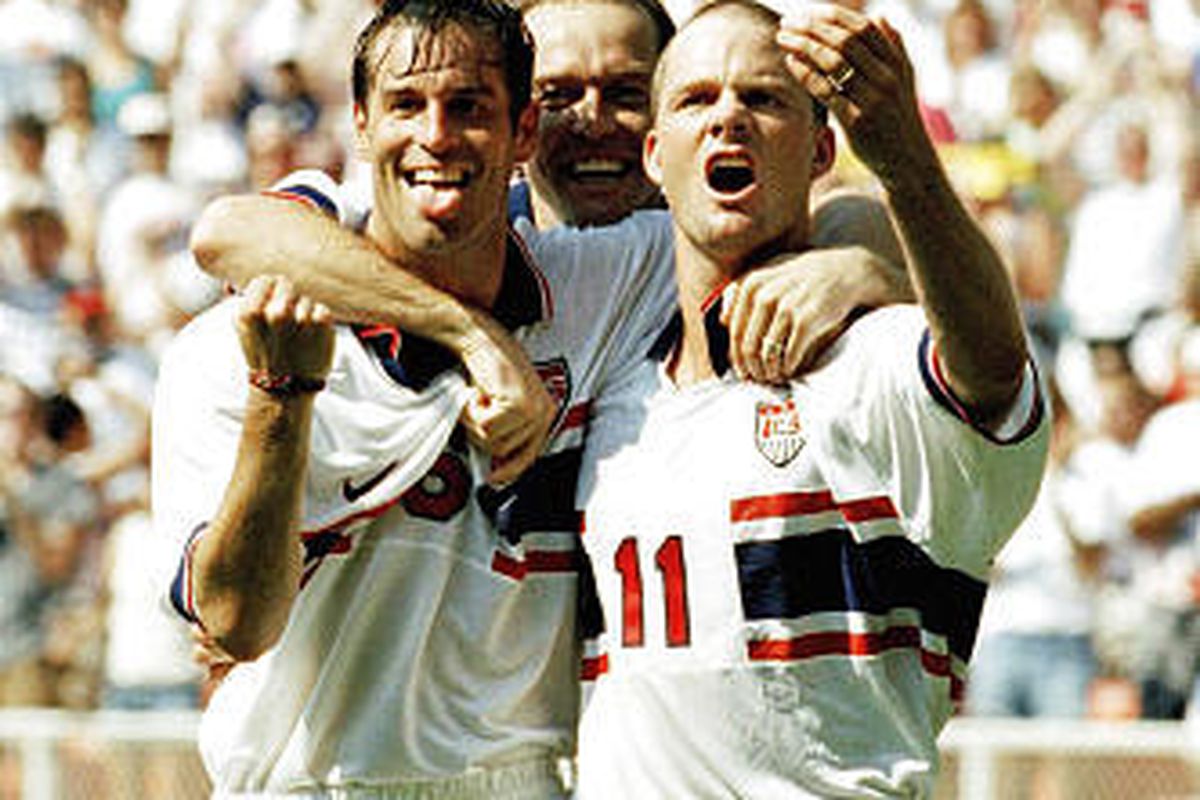 In this June 18, 1995 file photo, United States players, from left, midfielder John Harkes (6), midfielder Thomas Dooley (5); and forward Eric Wynalda (11) celebrate Wynalda's goal during the first half of a soccer game against Mexico at RFK stadium in Wa