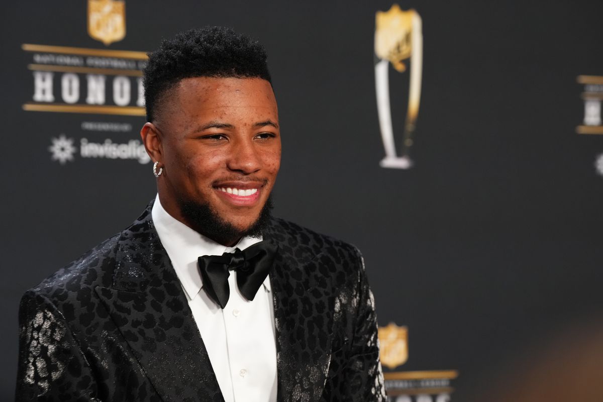 Saquon Barkley poses for a photo on the red carpet during NFL Honors at the Symphony Hall on February 9, 2023 in Phoenix, Arizona.
