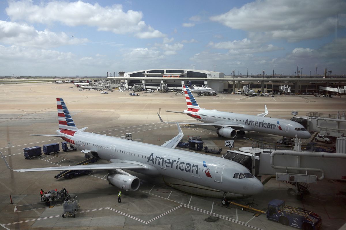 In this June 16, 2018, file photo, American Airlines aircrafts are seen at Dallas-Fort Worth International Airport in Grapevine, Texas.