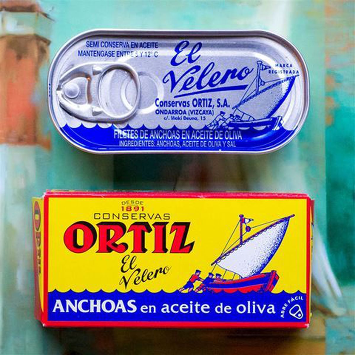 An anchovy tin and a cardboard anchovy box