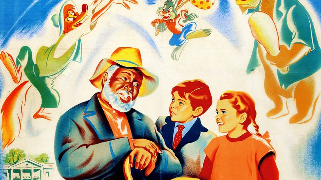 Detail from a 1946 poster for Disney’s movie Song Of The South, featuring a painted image of Black field hand Uncle Remus (James Baskett) telling stories to two white children, as cartoon versions of Brer Fox, Brer Rabbit, and Brer Bear hover overhead