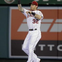 Los Angeles Angels' Josh Hamilton catches a fly ball hit by Seattle Mariners' Kyle Seager during the fifth inning of a baseball game in Anaheim, Calif., Tuesday, June 18, 2013. 