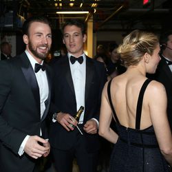  Chris Evans, and from left, Miles Teller and Sienna Miller are seen backstage at the Oscars on Sunday, Feb. 22, 2015, at the Dolby Theatre in Los Angeles. 