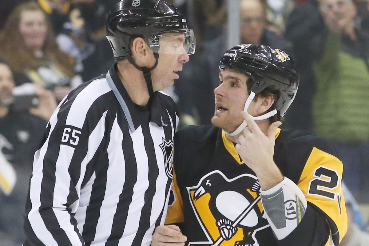 Steve Downie with the tallest ref in the league.