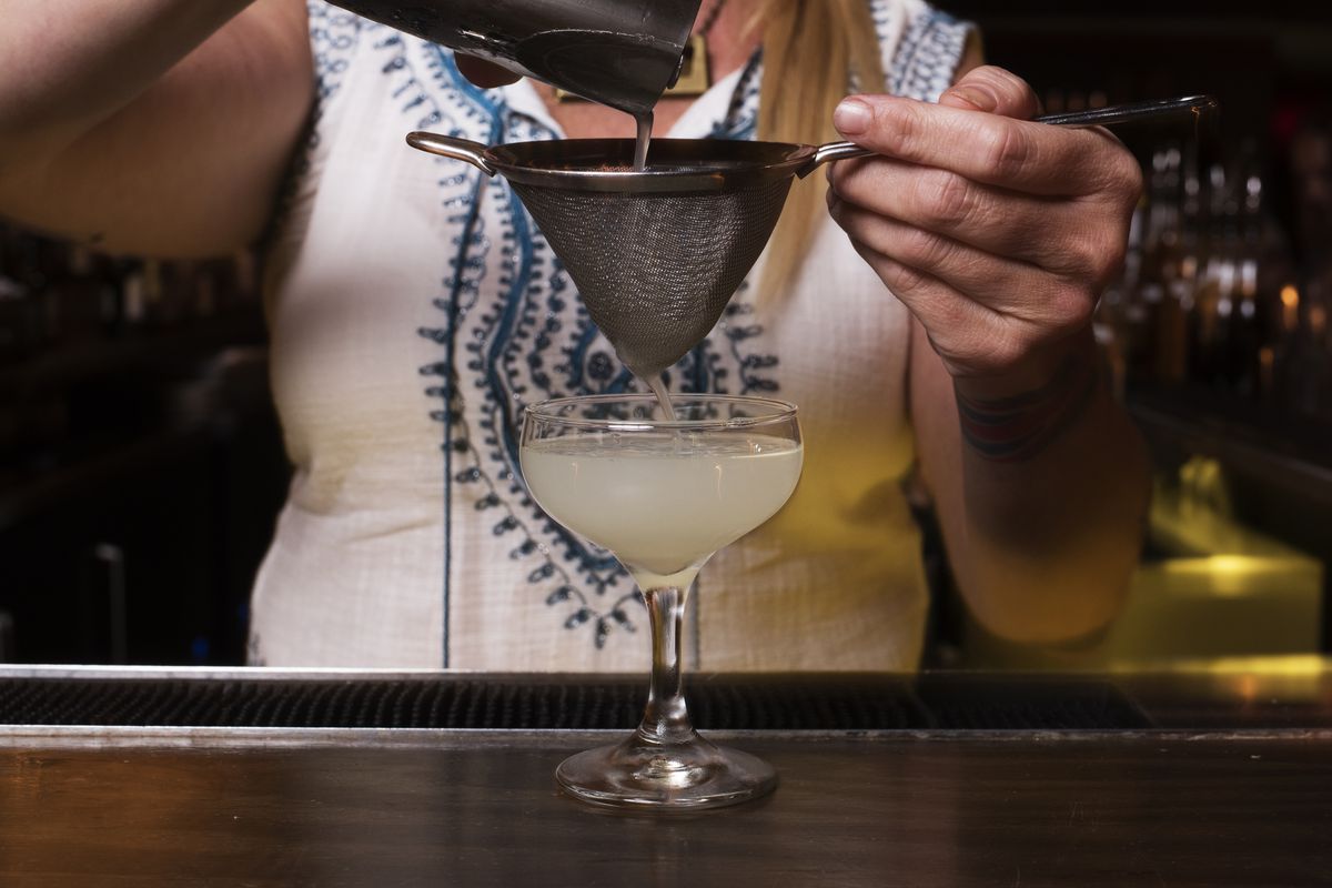 A bartender prepares a cocktail at The Quarter + Glory in Washington, DC, on September 14, 2016.