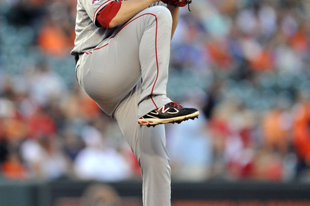 June 26, 2012; Baltimore, MD, USA; Los Angeles Angels starting C.J. Wilson (33) pitches in the first inning against the Baltimore Orioles at Oriole Park at Camden Yards. Mandatory Credit: Joy R. Absalon-US PRESSWIRE