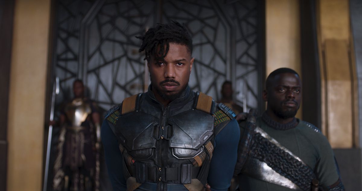 Erik Killmonger (Michael B. Jordan) enters the throne room of Wakanda, followed by W’Kabi (Daniel Kaluuya) in 2018’s Black Panther