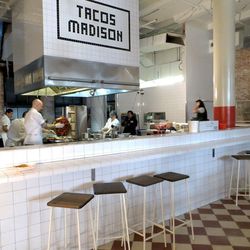 Tacos Madison is the name of the taqueria inside Cafe El Presidente. Behind the bar, Jason DeBriere packs meat for al pastor tacos onto a rotating trompo, a process he compares to making a sculpture. Owner Dario Wolos says he offered the job to DeBriere a