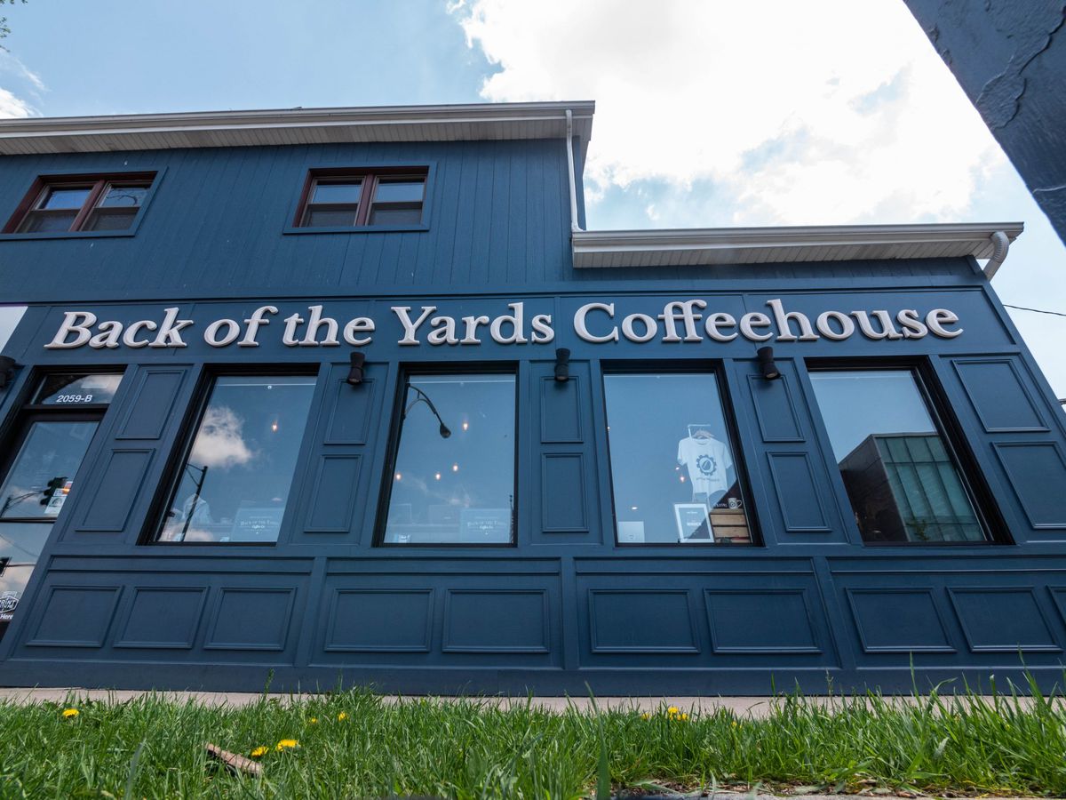 A large blue building with “Back of the Yards Coffeehouse” in white letters.