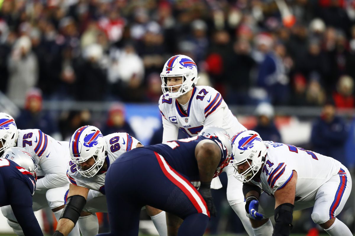 Quarterback Josh Allen #17 of the Buffalo Bills looks over the line of scrimmage during the fourth quarter of the game against the New England Patriots at Gillette Stadium on December 26, 2021 in Foxborough, Massachusetts.
