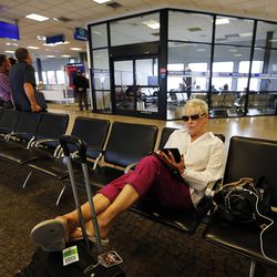 Maggie Podunovich waits for her flight at Salt Lake City International Airport, Monday, Aug. 3, 2015. She is a former smoker but dislikes being around cigarette smoke.