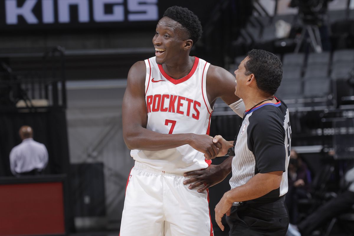 Victor Oladipo of the Houston Rockets shares a laugh with NBA referee Bill Kennedy during the game against the Sacramento Kings on March 11, 2021 at Golden 1 Center in Sacramento, California.&nbsp;