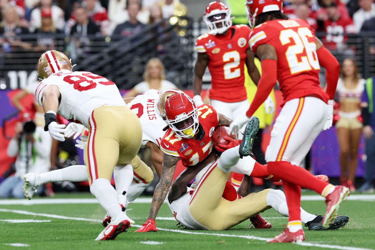 Richie James #17 of the Kansas City Chiefs is tackled in the first quarter against the San Francisco 49ers during Super Bowl LVIII at Allegiant Stadium on February 11, 2024 in Las Vegas, Nevada.