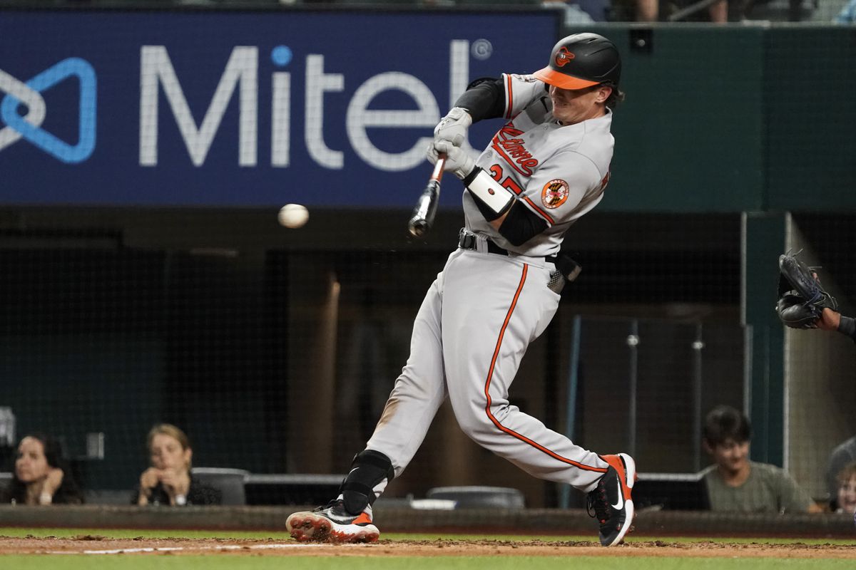 Baltimore Orioles catcher Adley Rutschman (35) hits a double during the fifth inning against the Texas Rangers at Globe Life Field.&nbsp;