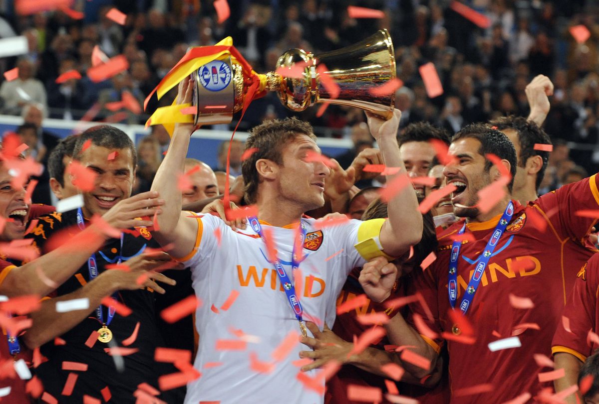 AS Roma’s captain Francesco Totti holds