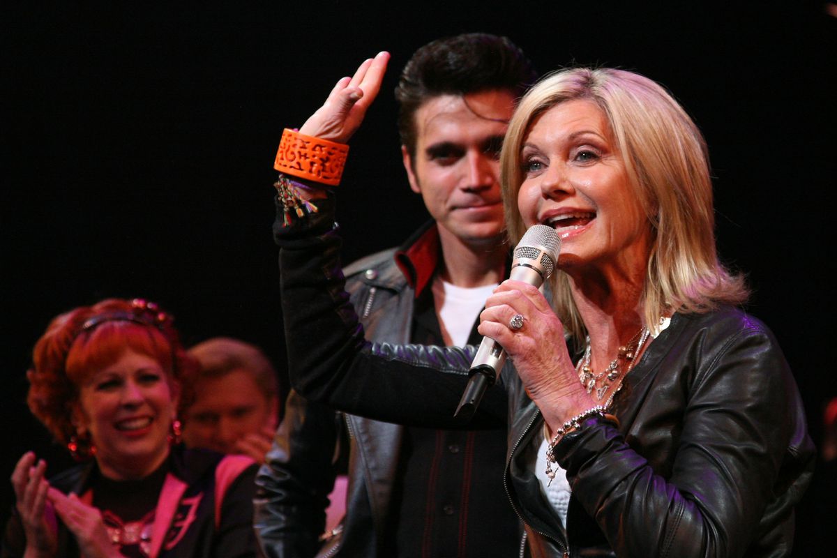 Olivia Newton-John &amp; Cast Of ‘Grease’ Promote Breast Cancer Awareness