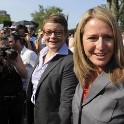 California's Proposition 8 plaintiffs, Kris Perry and Sandy Steir walk into the Supreme Court in Washington, Wednesday, June 26, 2013.  The Supreme Court is meeting to deliver opinions in two cases that could dramatically alter the rights of gay people across the United States. The justices are expected to decide their first-ever cases about gay marriage Wednesday in their last session before the court's summer break. 