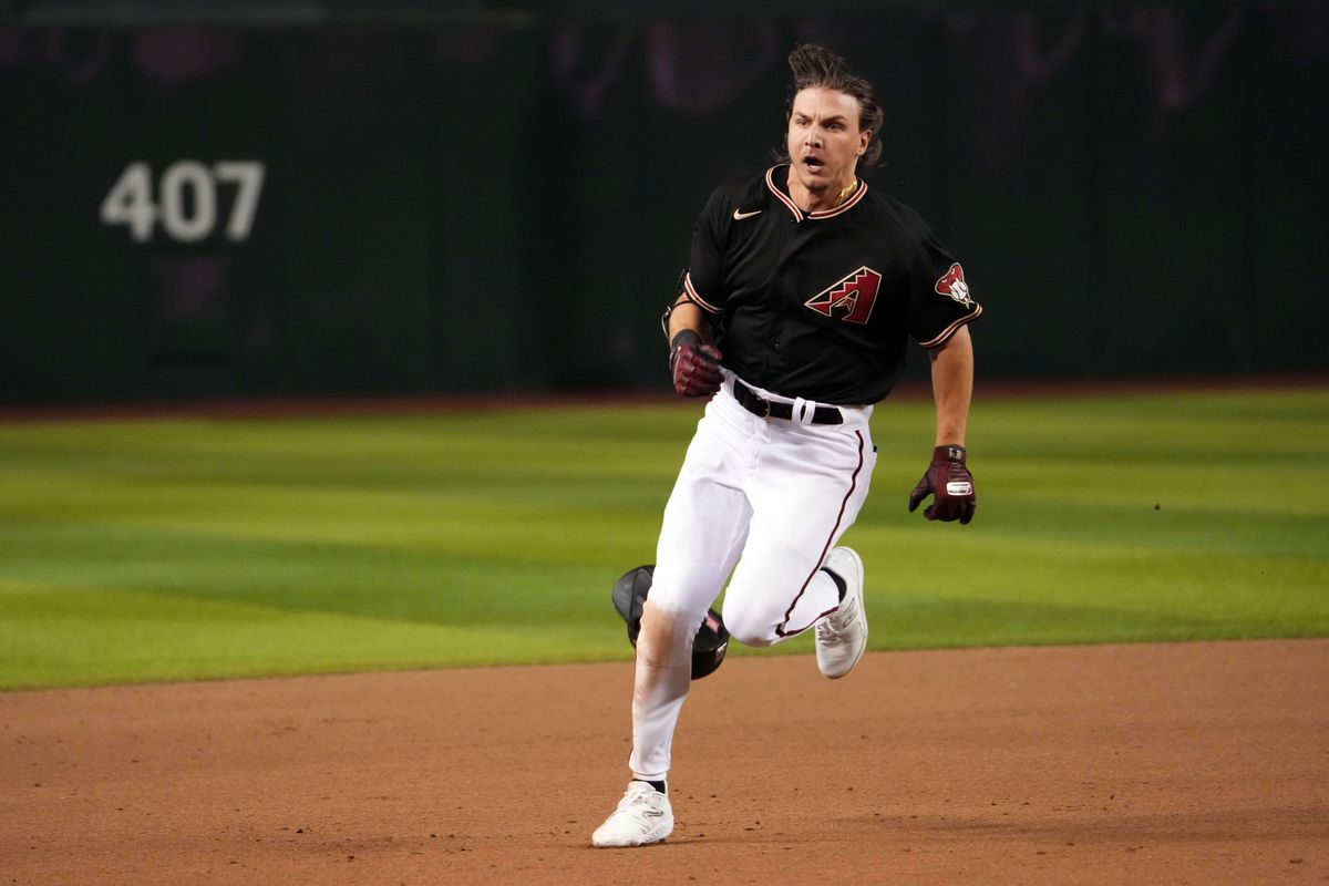 Arizona Diamondbacks right fielder Jake McCarthy runs to third base en route a triple against the Los Angeles Dodgers during the seventh inning at Chase Field.