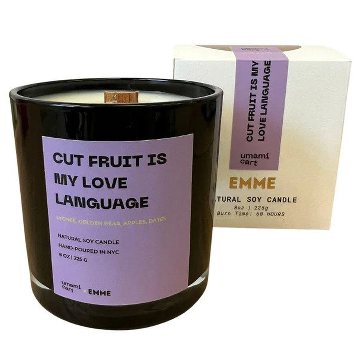 A candle with a label that reads “cut fruit is my love language”