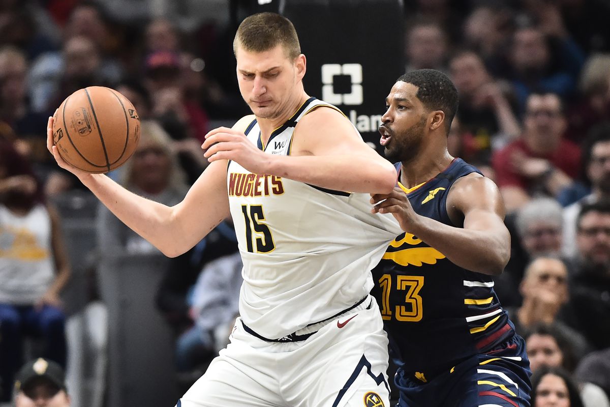 Cleveland Cavaliers center Tristan Thompson pressures Denver Nuggets center Nikola Jokic during the second half at Rocket Mortgage FieldHouse.