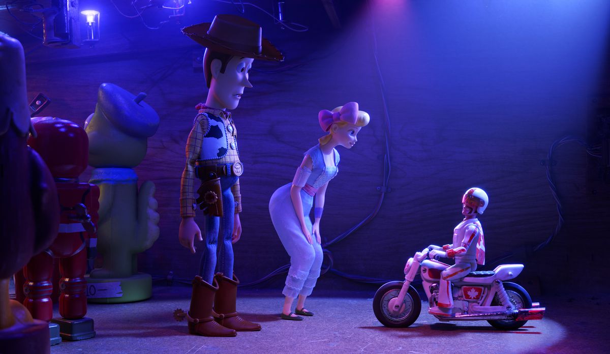 Woody (Tom Hanks), left, Bo Beep (Annie Potts) and Duke Caboom (Keanu Reeves) in a scene from the film "Toy Story 4."