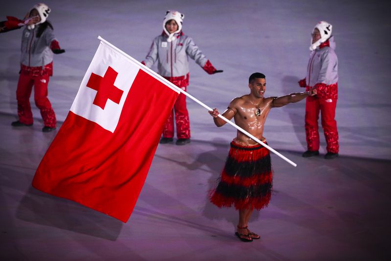 Flag bearer Pita Taufatofua of Tonga