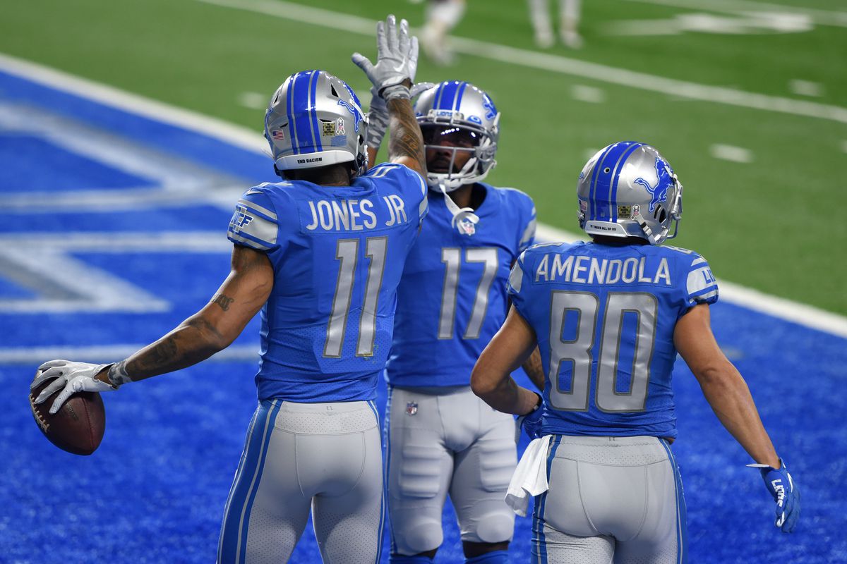 Marvin Jones #11, Marvin Hall #17, and Danny Amendola #80 of the Detroit Lions react following a touchdown during their game against the Washington Football Team at Ford Field on November 15, 2020 in Detroit, Michigan.