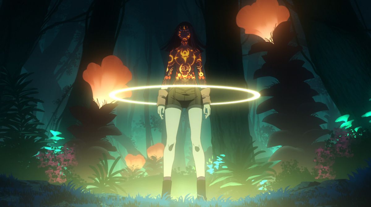 A woman standing in a forest of glowing alien-like plants, surrounded by a halo of light as intricate circular symbols bath the upper half of her body in Metallic Rouge.