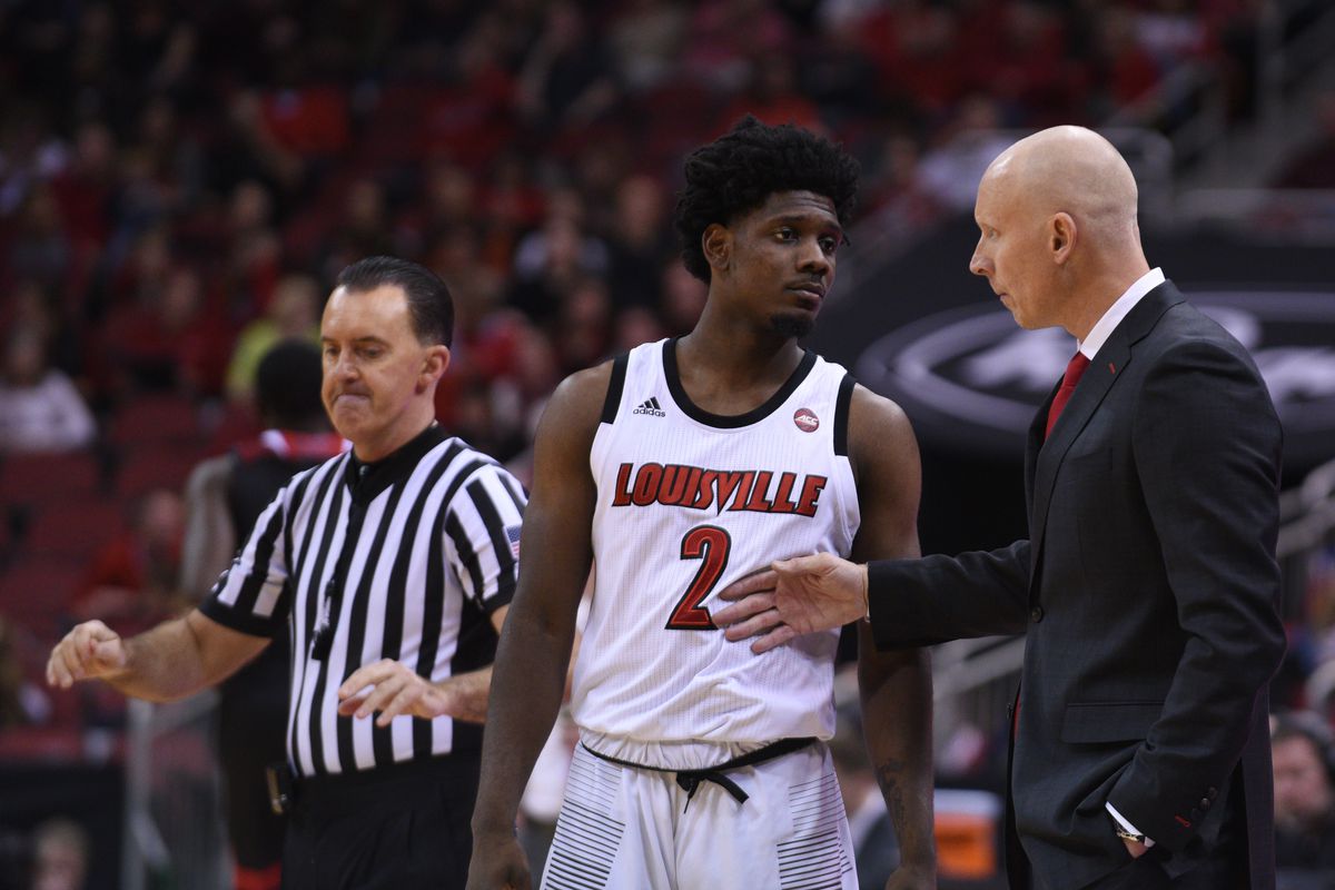 Chris Mack coaches Darius Perry on the sideline of the win over Nicholls State.