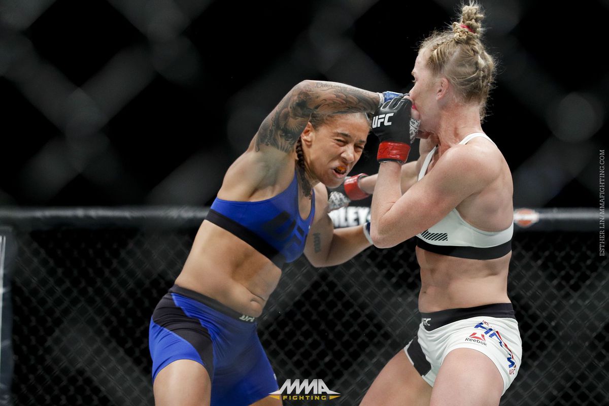 Germaine de Randamie lands a punch on Holly Holm at UFC 208.