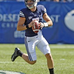 Brigham Young Cougars quarterback James Lark (7) rolls out during a game against Weber State University Saturday, Sept. 8, 2012, in Provo, Utah.