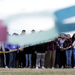 Students form a paper chain during a student walkout to honor those killed in Parkland, Florida at Northwest Middle School in Salt Lake City on Wednesday, March 14, 2018. 
It has been one month since 17 people were killed at Marjory Stoneman Douglas High School in Parkland. The 10 a.m. protest lasted 17 minutes, one minute for each of the victims killed at the high school.
