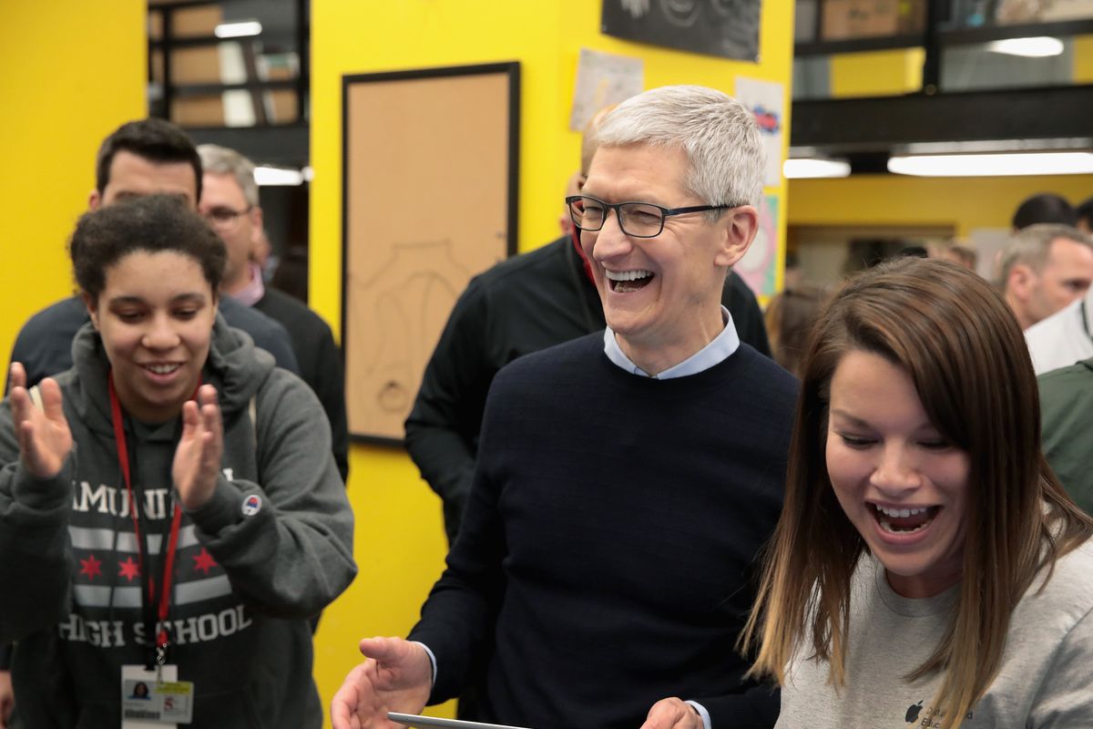 Apple CEO Tim Cook gets a demonstration of an app during an event held to introduce the new 9.7-inch Apple iPad at Lane Tech College Prep High School on March 27, 2018, in Chicago, Illinois.