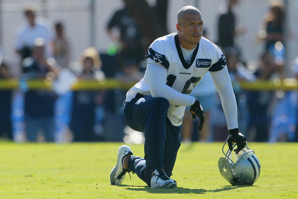 OXNARD CA - AUGUST 14:  Wide receiver Miles Austin #19 looks on during Dallas Cowboys Training Camp at the Marriott Residence Inn Oxnard River Ridge on August 14 2010 in Oxnard California.  (Photo by Jeff Gross/Getty Images)