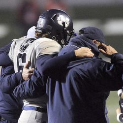 Utah State Aggies quarterback Darell Garretson (6) gets helped off the field after a hit during the Mountain West football championship game at Bulldog Stadium in Fresno, Calif., on Saturday, Dec. 7, 2013.