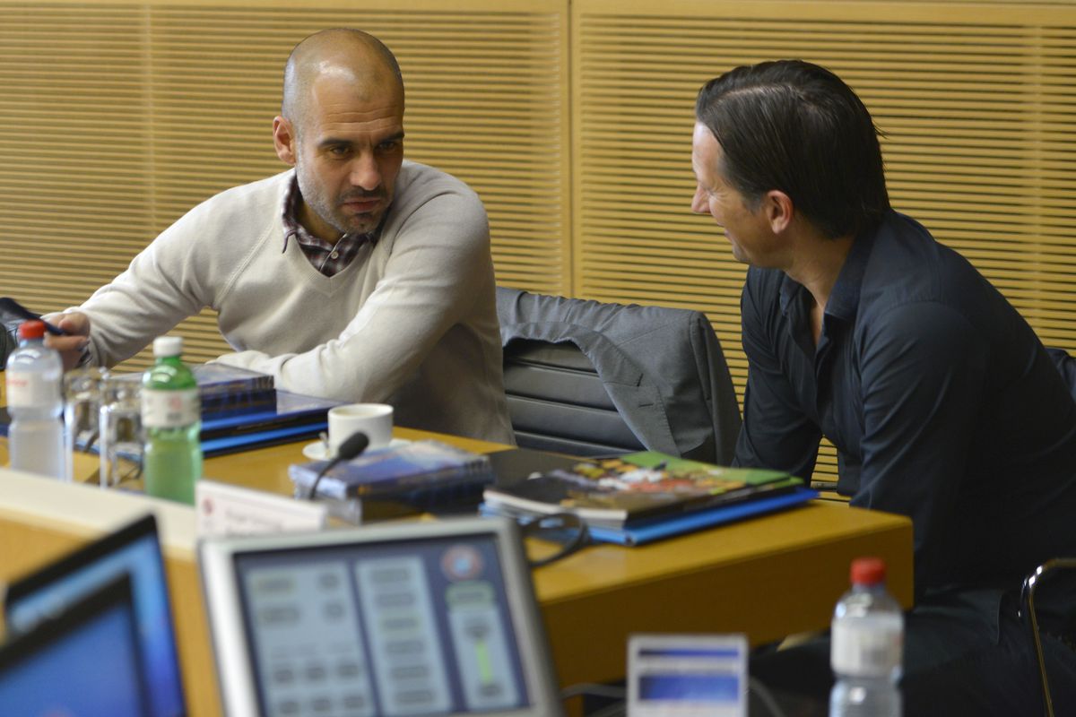 Pep Guardiola and Roger Schmidt at the UEFA Coaches conference