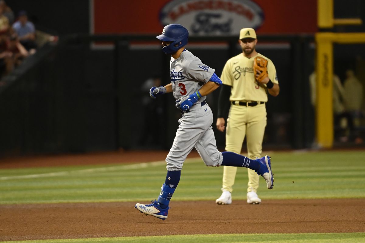 Chris Taylor of the Los Angeles Dodgers rounds the bases after hitting a solo home run during the fourth inning against the Arizona Diamondbacks at Chase Field on April 07, 2023 in Phoenix, Arizona.