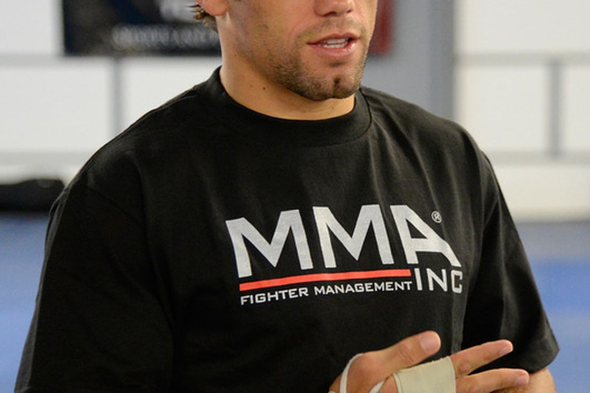 SACRAMENTO, CA - JUNE 26:  Urijah Faber wraps his hands before he works out for the media during the Team Alpha Male Media Open Workout at Ultimate Fitness Gym on June 26, 2012 in Sacramento, California.  (Photo by Thearon W. Henderson/Getty Images)