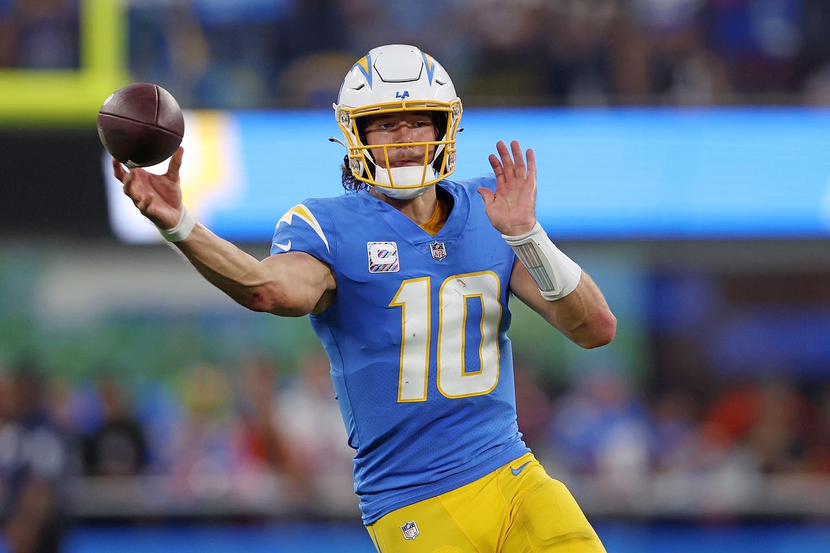 INGLEWOOD, CALIFORNIA - OCTOBER 17: Justin Herbert #10 of the Los Angeles Chargers looks to pass during the second quarter against the Denver Broncos at SoFi Stadium on October 17, 2022 in Inglewood, California.