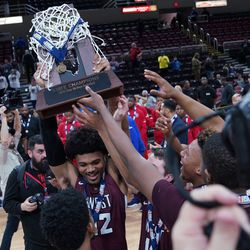 Belleville West’s holds up the 4A state championship trophy at Peoria Civc Center in Peoria IL, Saturday 03-16-19. Worsom Robinson/For the Sun-Times.