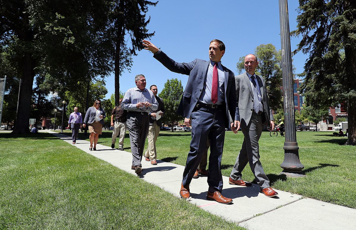 Lt. Gov. Spencer Cox, right, talks with Col. Brian Redd, deputy commissioner of Public Safety, as they tour Pioneer Park in the Rio Grande area of Salt Lake City on Monday, June 25, 2018.